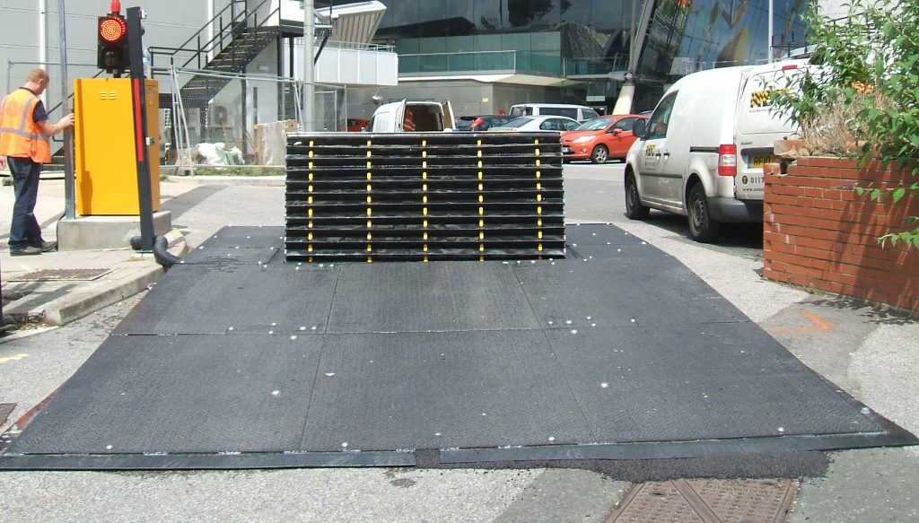 Surface PAS68 road blocker with safety debris skirt